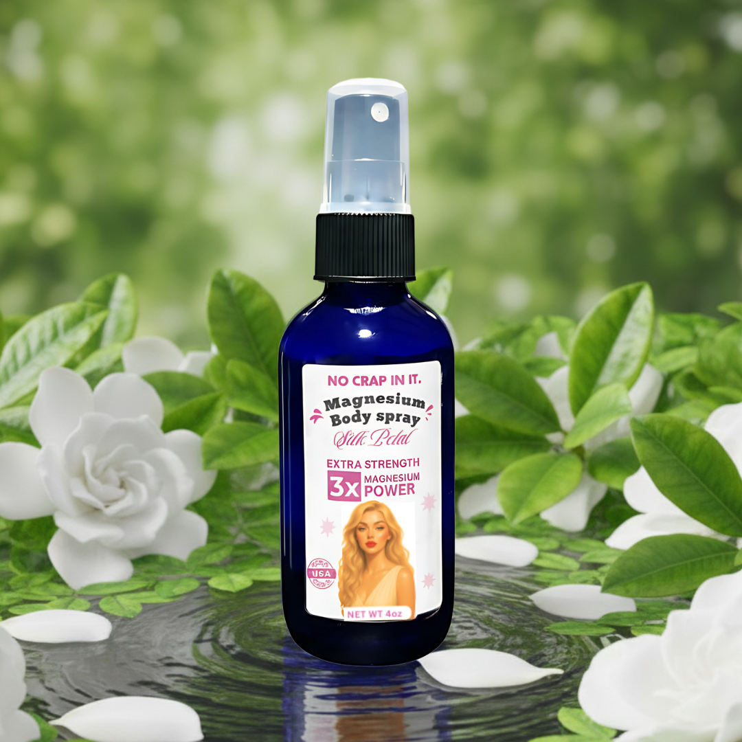 bottle of silk petal magnesium spray surrounded by white gardenia florals