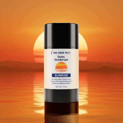 Black Detox Deodorant stick with a Sunrise front label on an orange background.