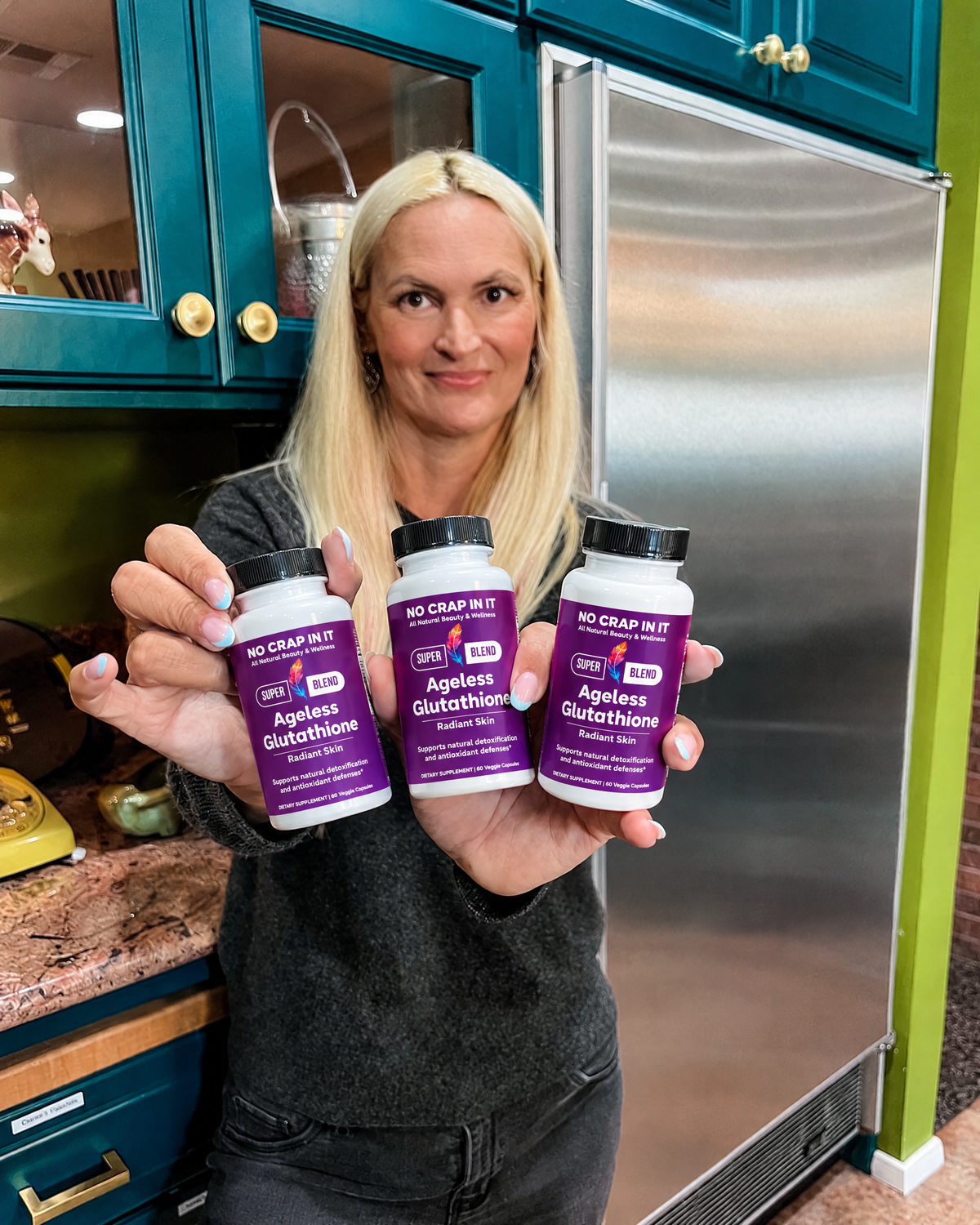 Feather, No Crap In It founder, holding Ageless Glutathione